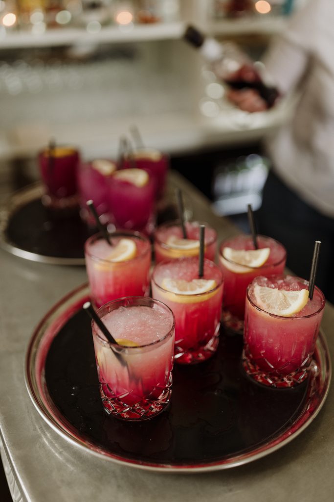 A tray of red berry bramble cocktails ready to be served to guests during the drinks reception at Middleton Lodge. 